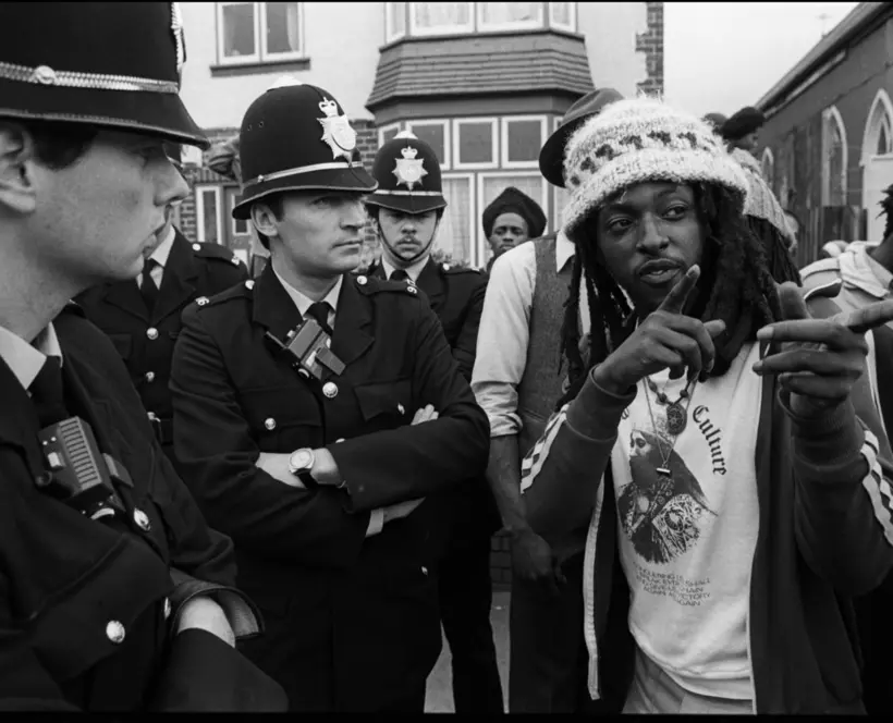 Rastafarian in discussion with police officers following a protest outside a church in Aston, Birmingham 1982 © Derek Bishton