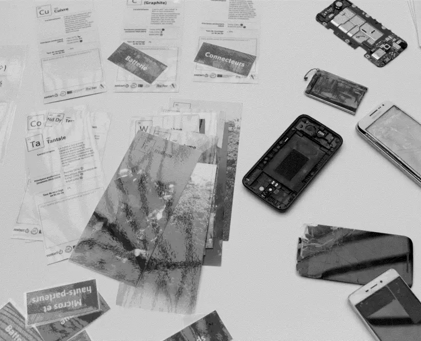 A dithered image of phones being dismantled and key information on the materials presented on a table.