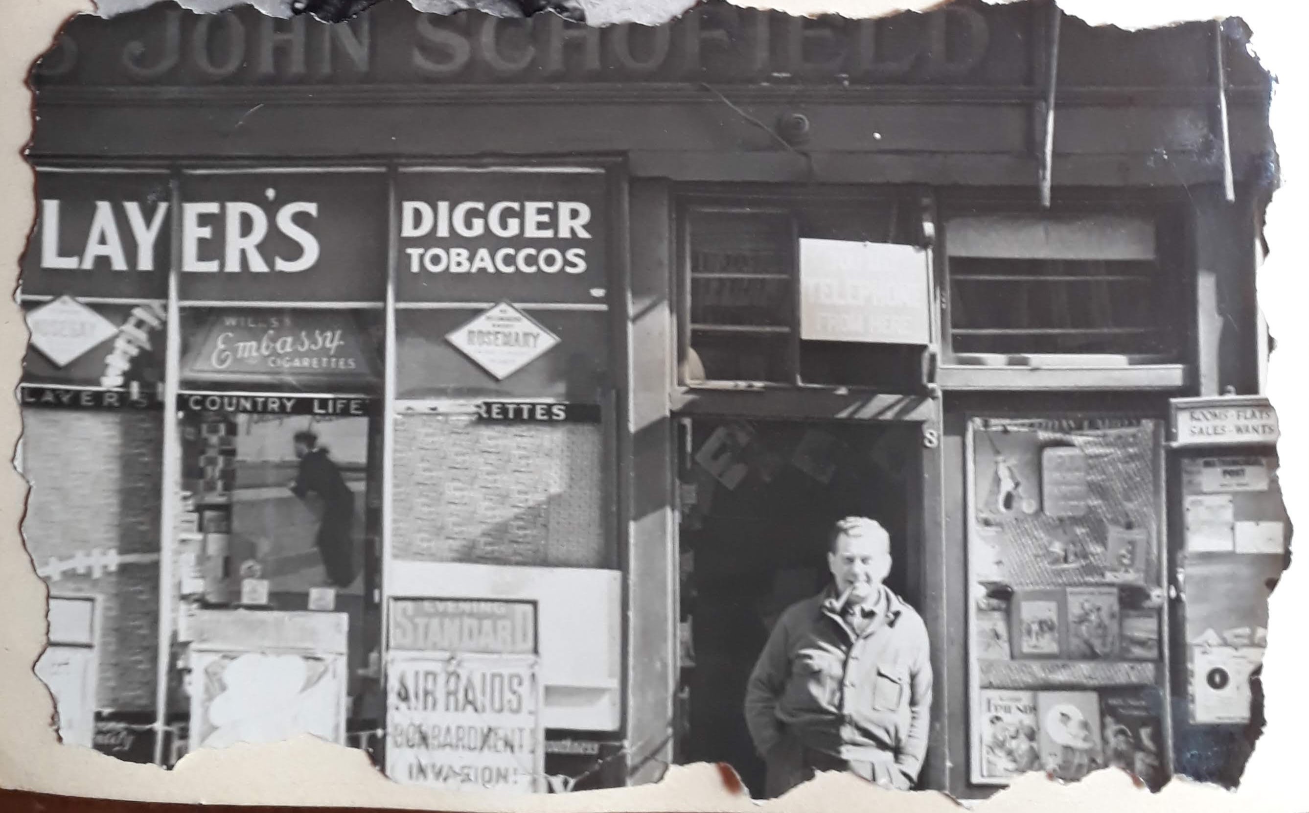John Schofield (Uncle Johnny) in the doorway of his sweet and toy shop, Newport Place