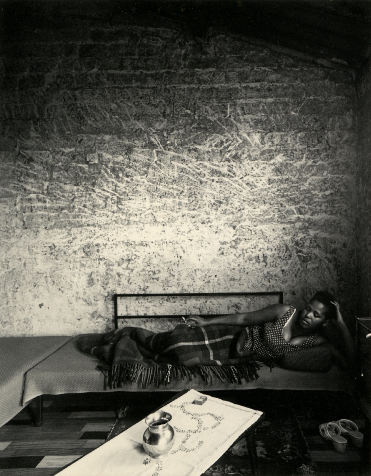 Image: Margaret Mcingana at home, Sunday afternoon, Zola, Soweto, October 1970. © David Goldblatt. PV Card for David Goldblatt - South Africa. Ephemera courtesy The Photographers' Gallery Archive, 1986