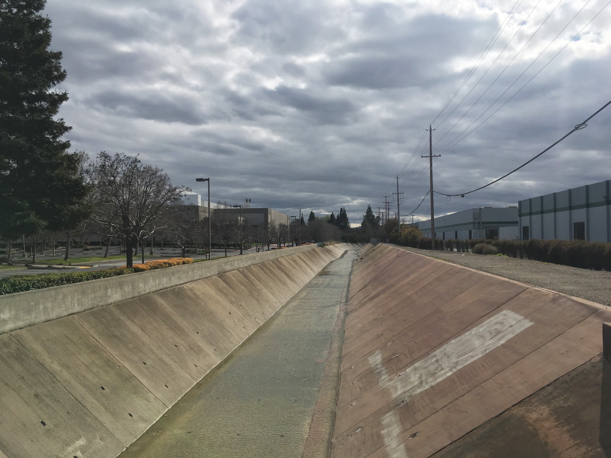 Calabazas Creek at Kifer Rd., looking south, with data centers on the right, courtesy of Jenny Odell