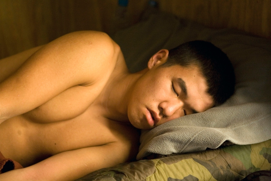 Tim Hetherington. AFGHANISTAN. Korengal Valley, Kunar Province. July 2008. Specialist Steve Kim sleeping. Tim Hetherington/IWM/Magnum Photos