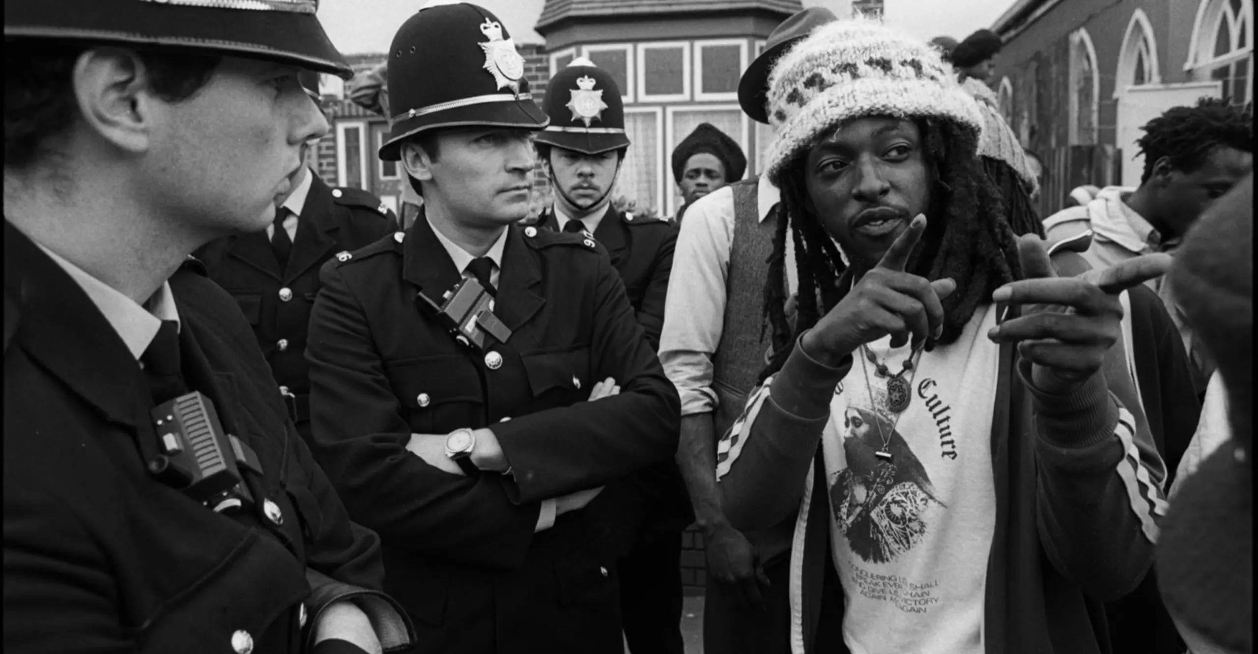 Rastafarian in discussion with police officers following a protest outside a church in Aston, Birmingham 1982 © Derek Bishton