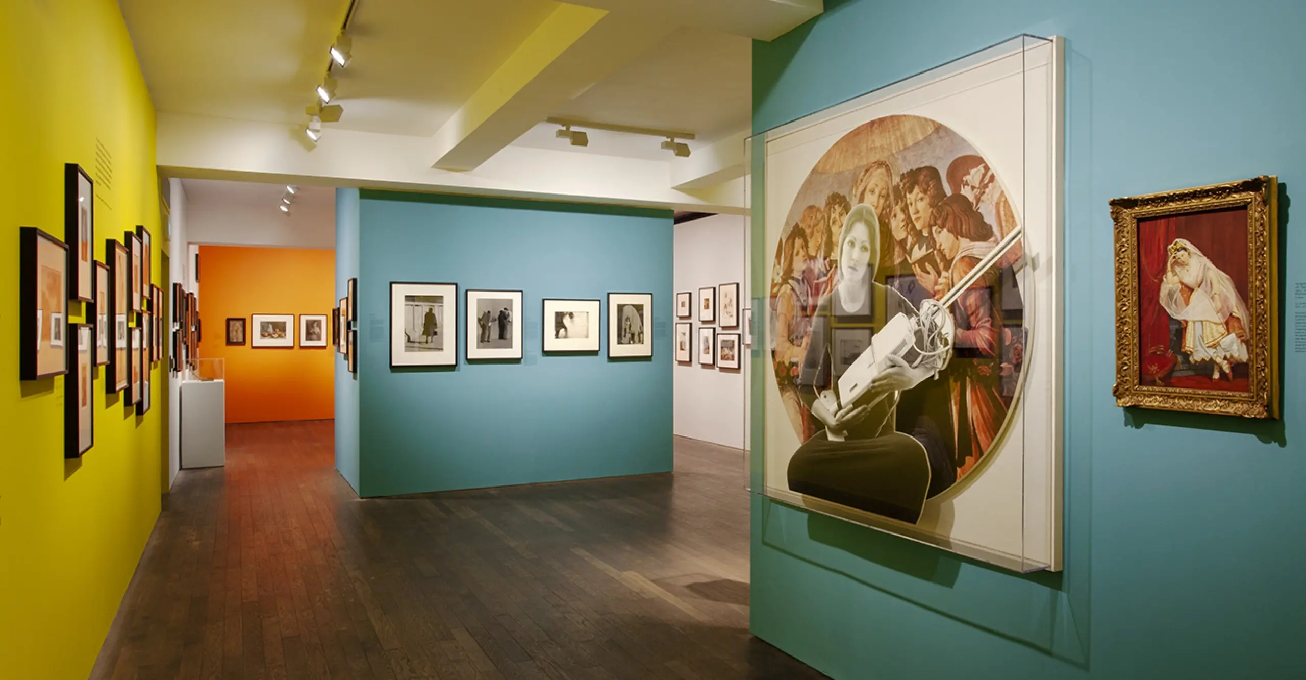 Installation view of Alternative History exh featuring blue, yellow and orange walls 