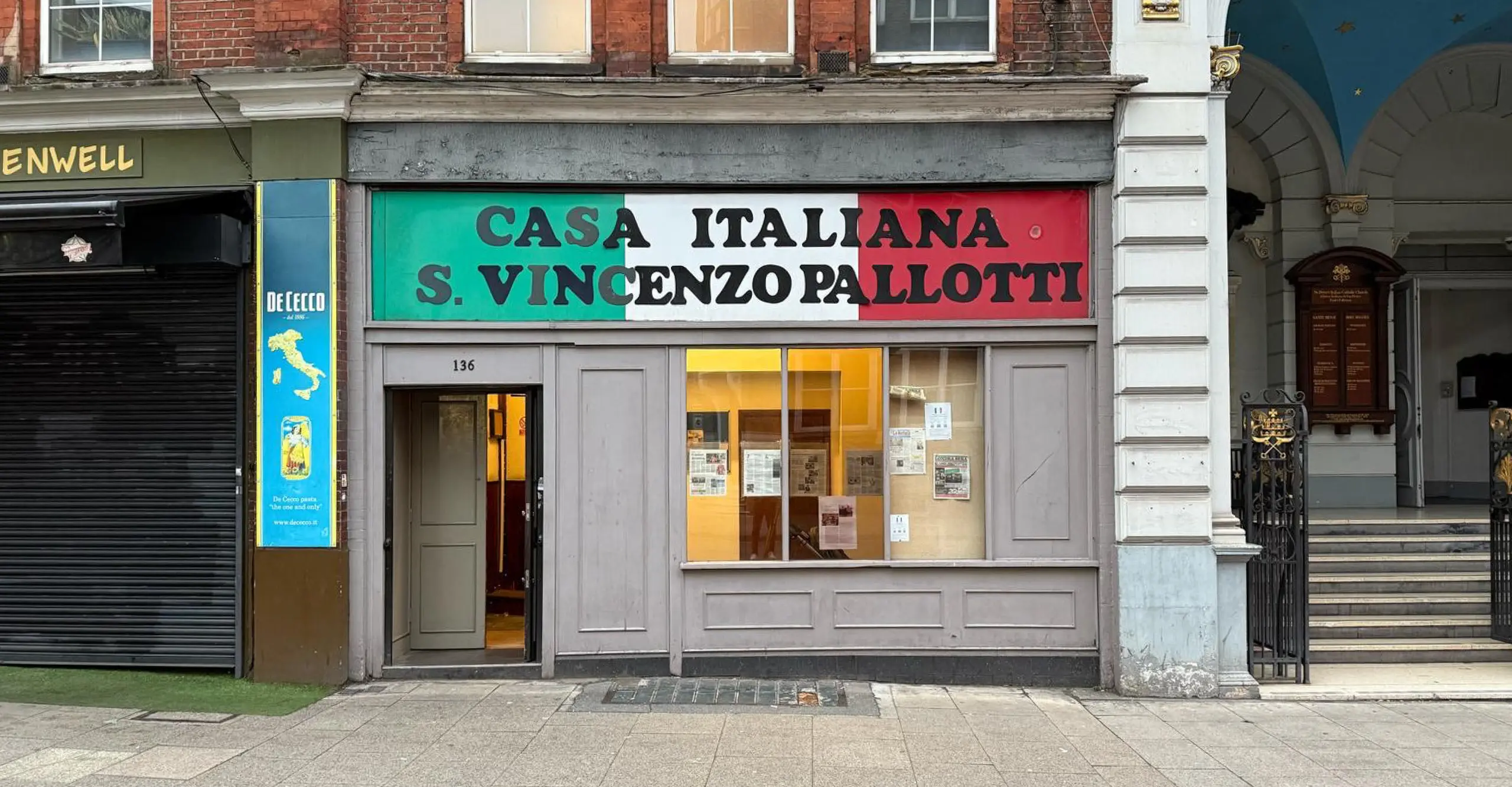 Image of a shop front with the sign above the door saying 'Casa Italiana – San Vincenzo Pallotti'