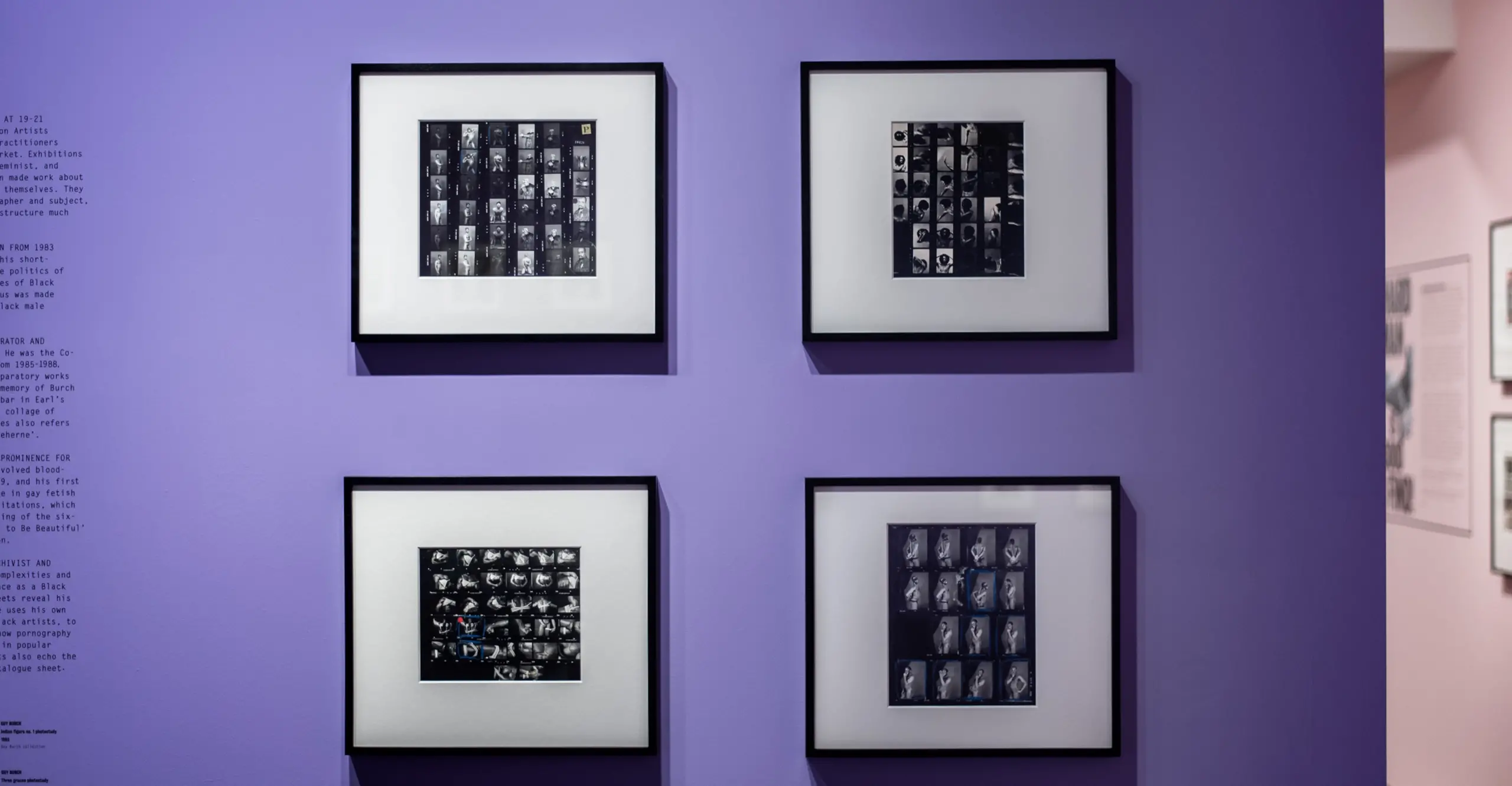 Installation shot of Ajamu X display featuring four B&W images against a medium purple wall