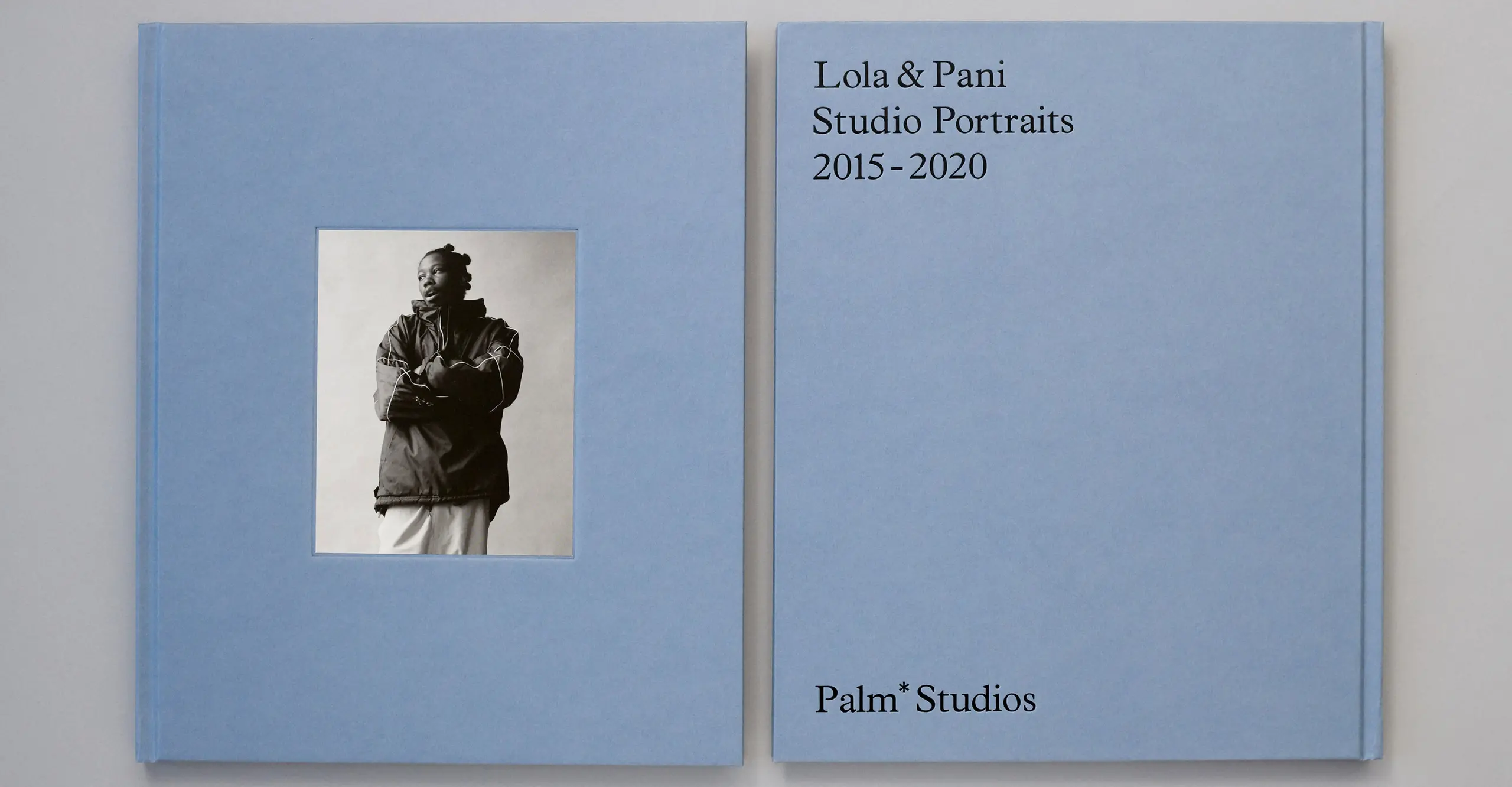 Back and front covers of a lilac coloured book with a black and white portrait of a figure on the front.