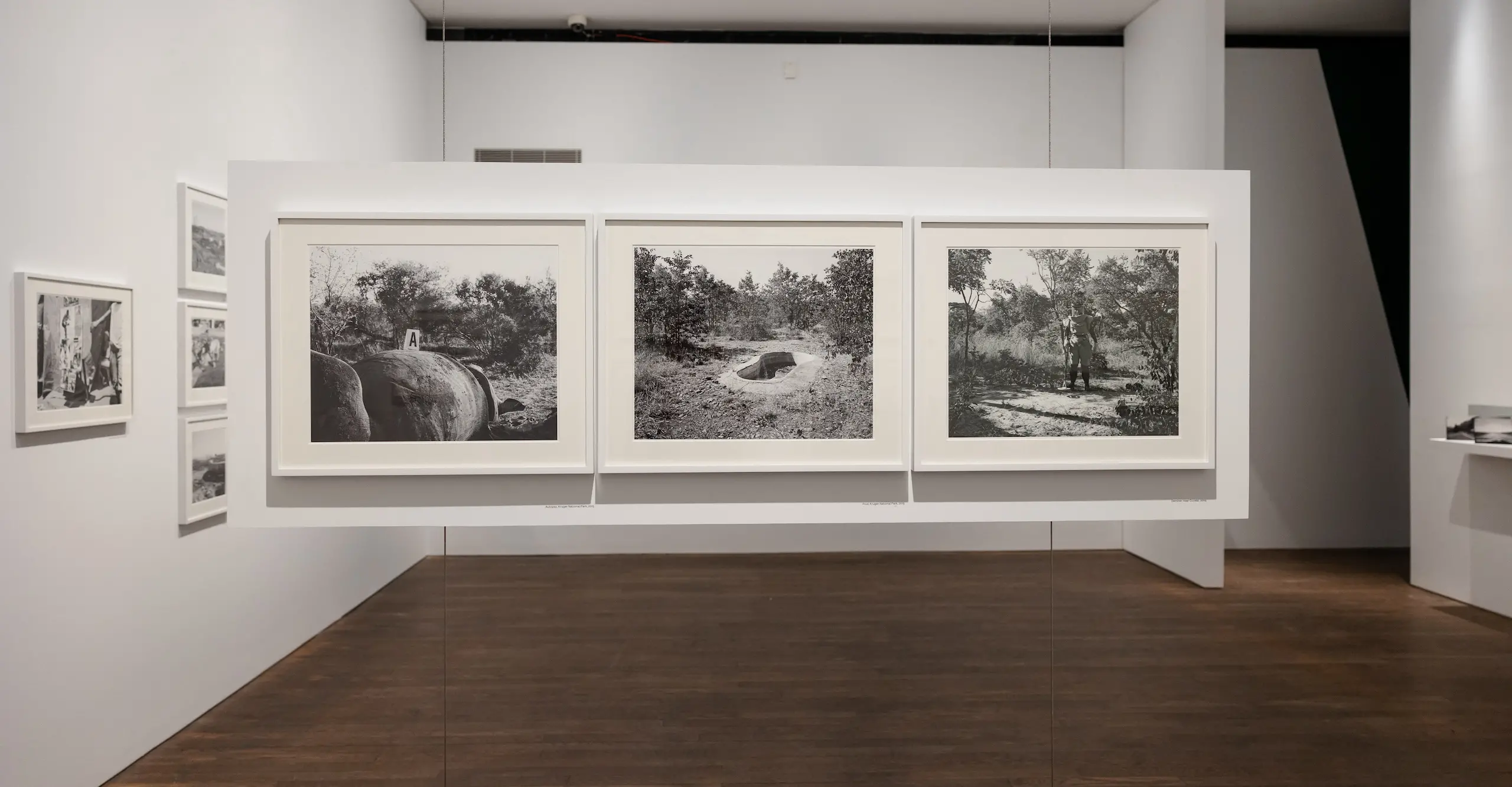 Black and white landscape photographs displayed in an exhibition space.
