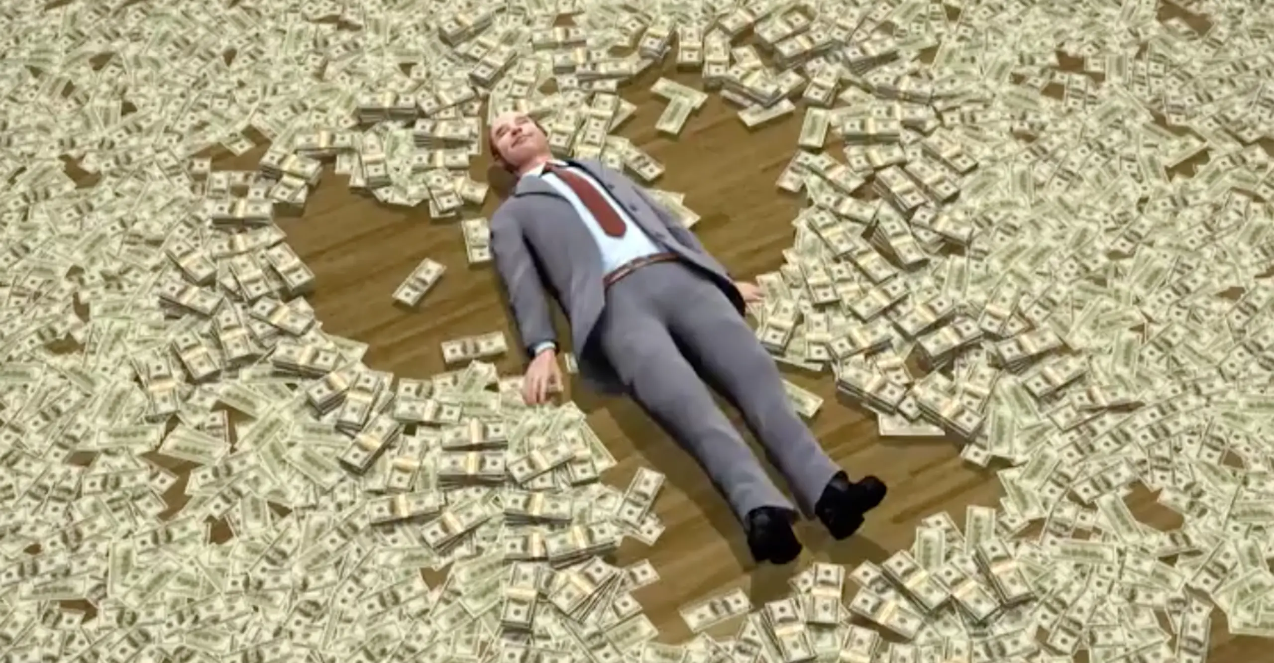 A man lying on the floor with money.