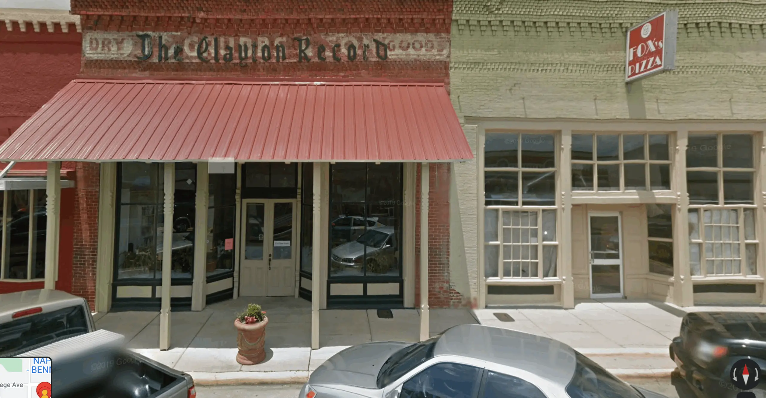 A screenshot of a view from Google Street View of the façades of various local businesses 