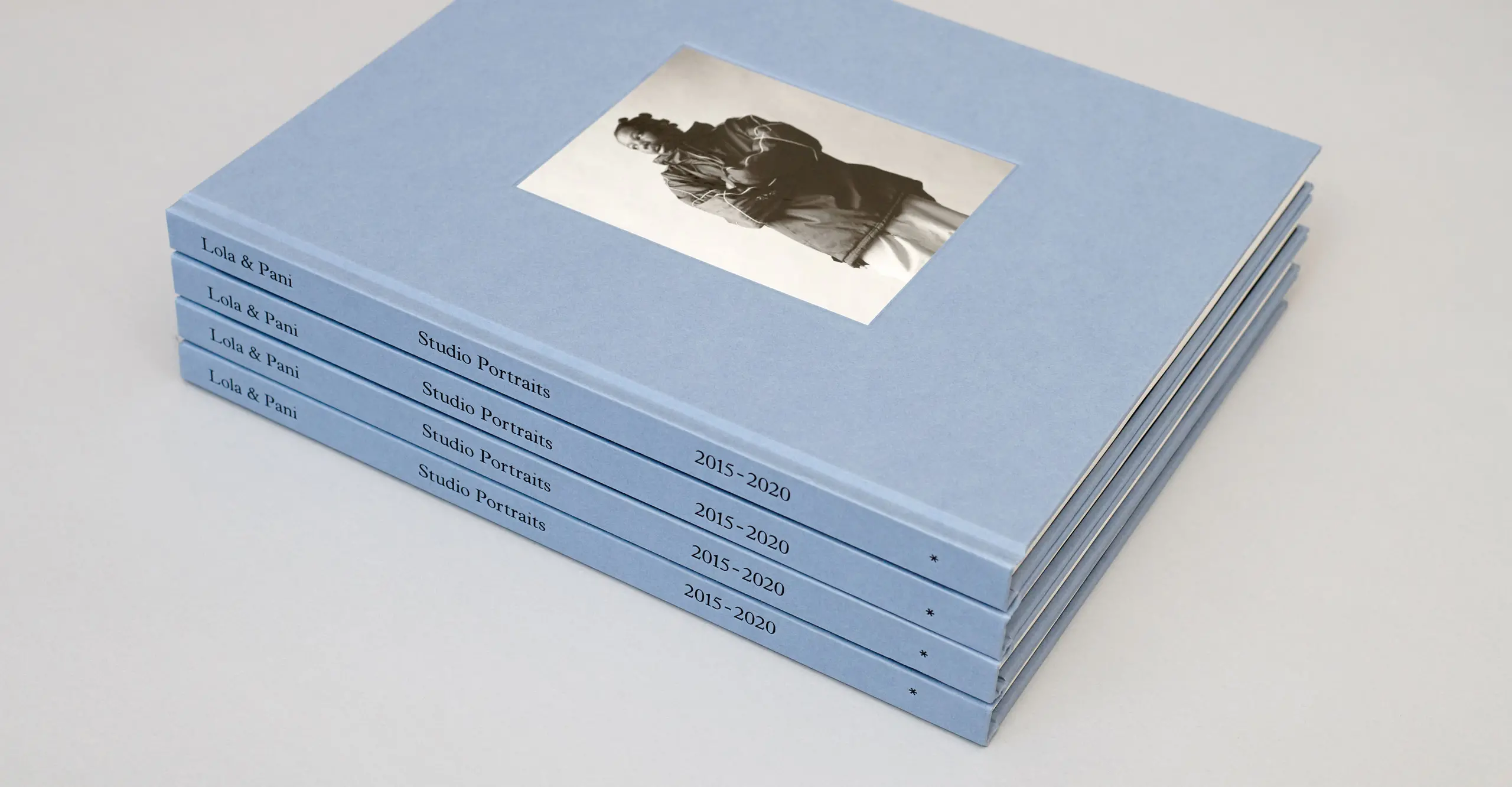 A stack of four blue books