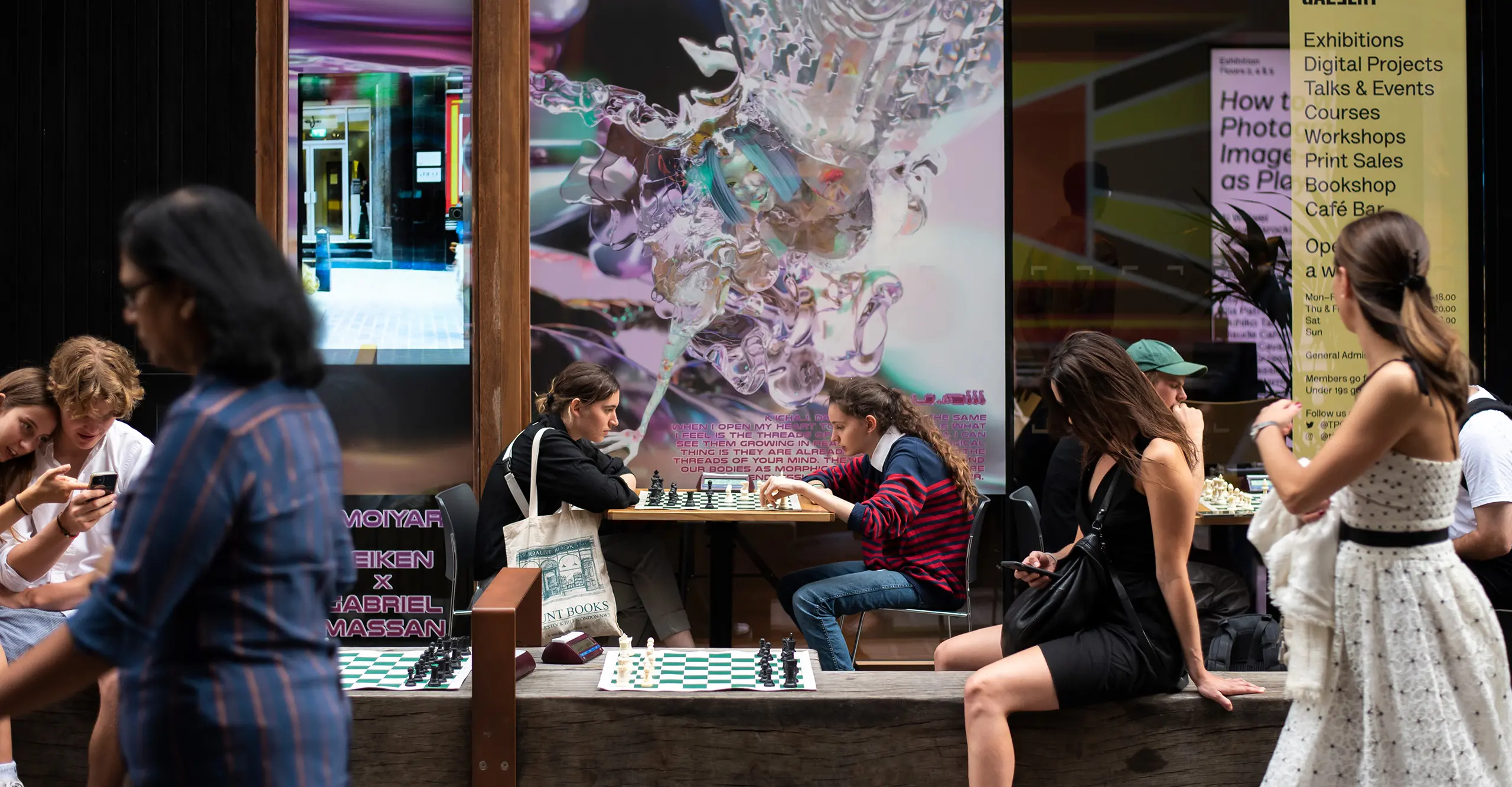 Image of groups of players enjoying games of chess at The Photographers Gallery