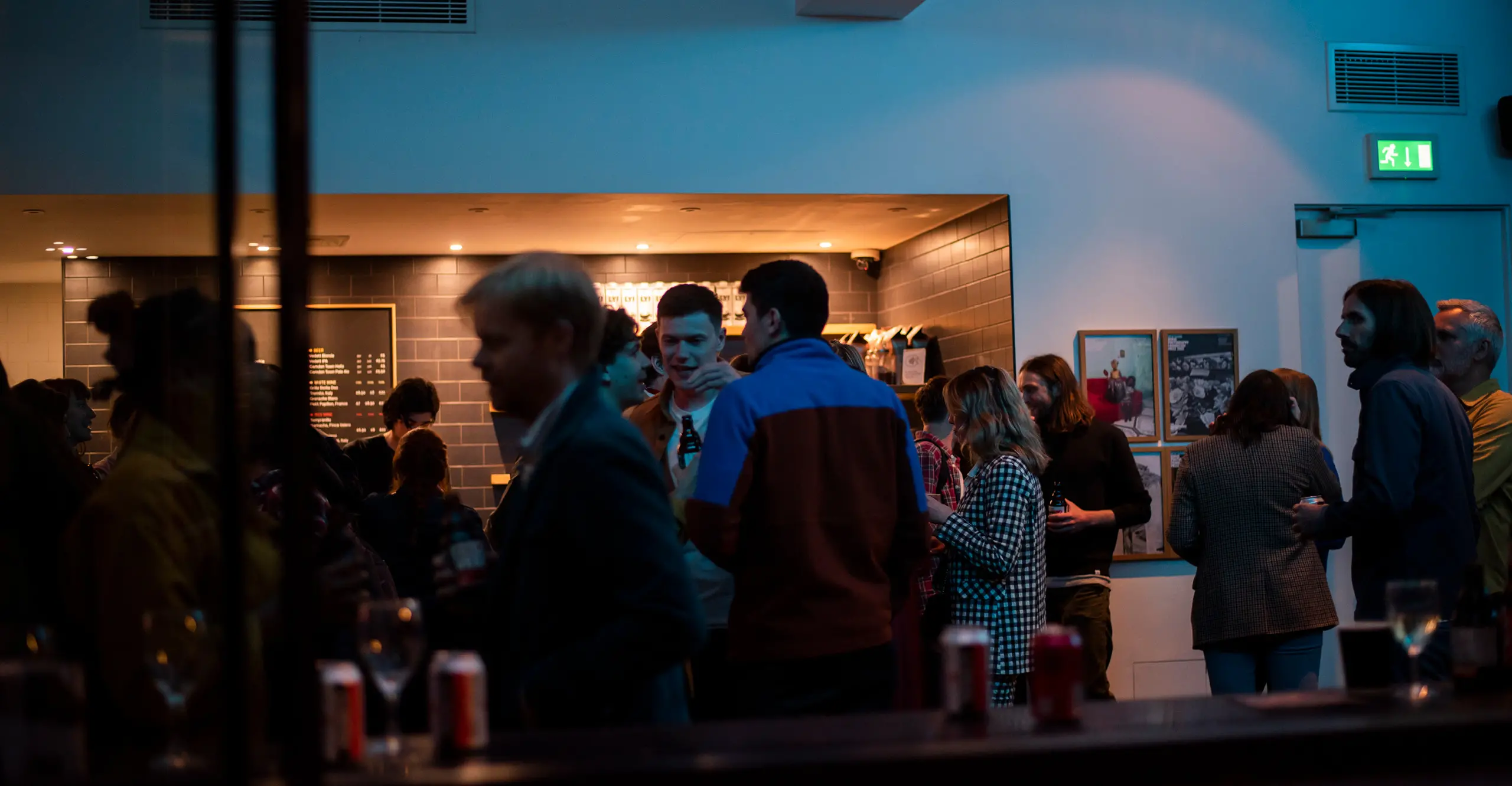 Group of people enjoying drinks at The Photographers Gallery's café bar