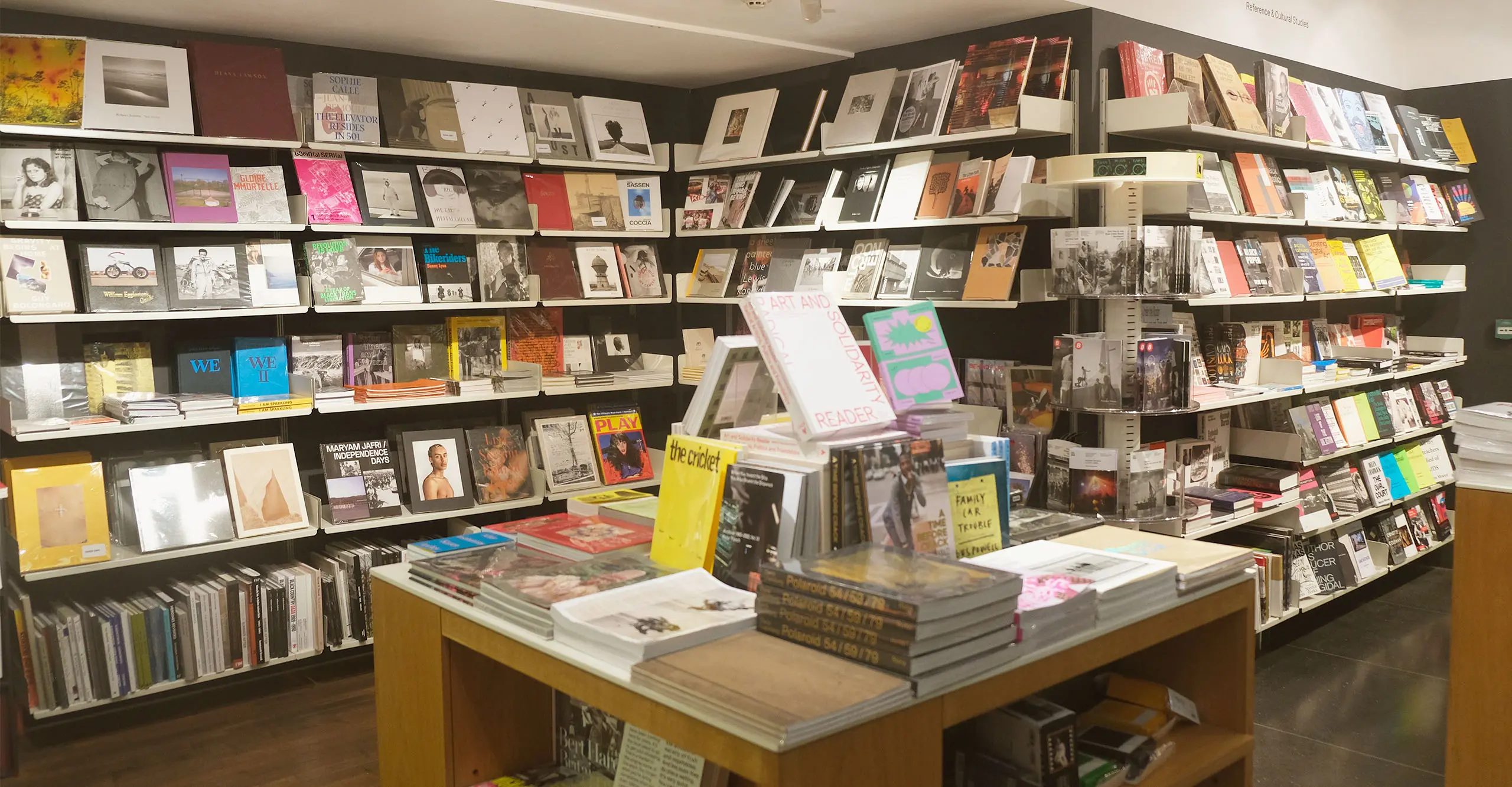 A photograph of shelves of books on display at The Photographers' Gallery Bookshop