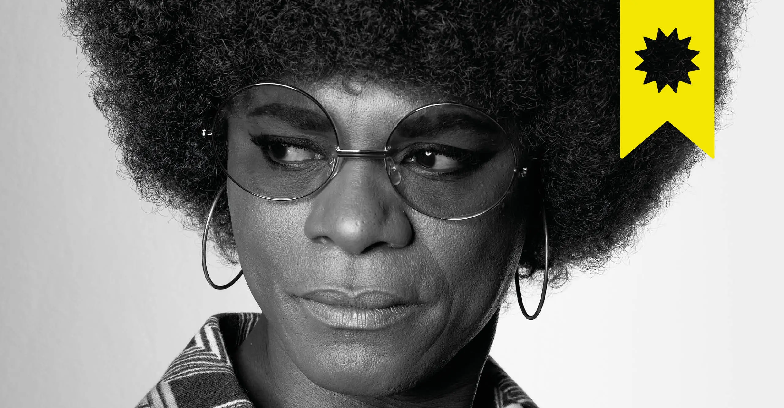 Black & white image of samuel fosso dressed up as American activist Angela Davis