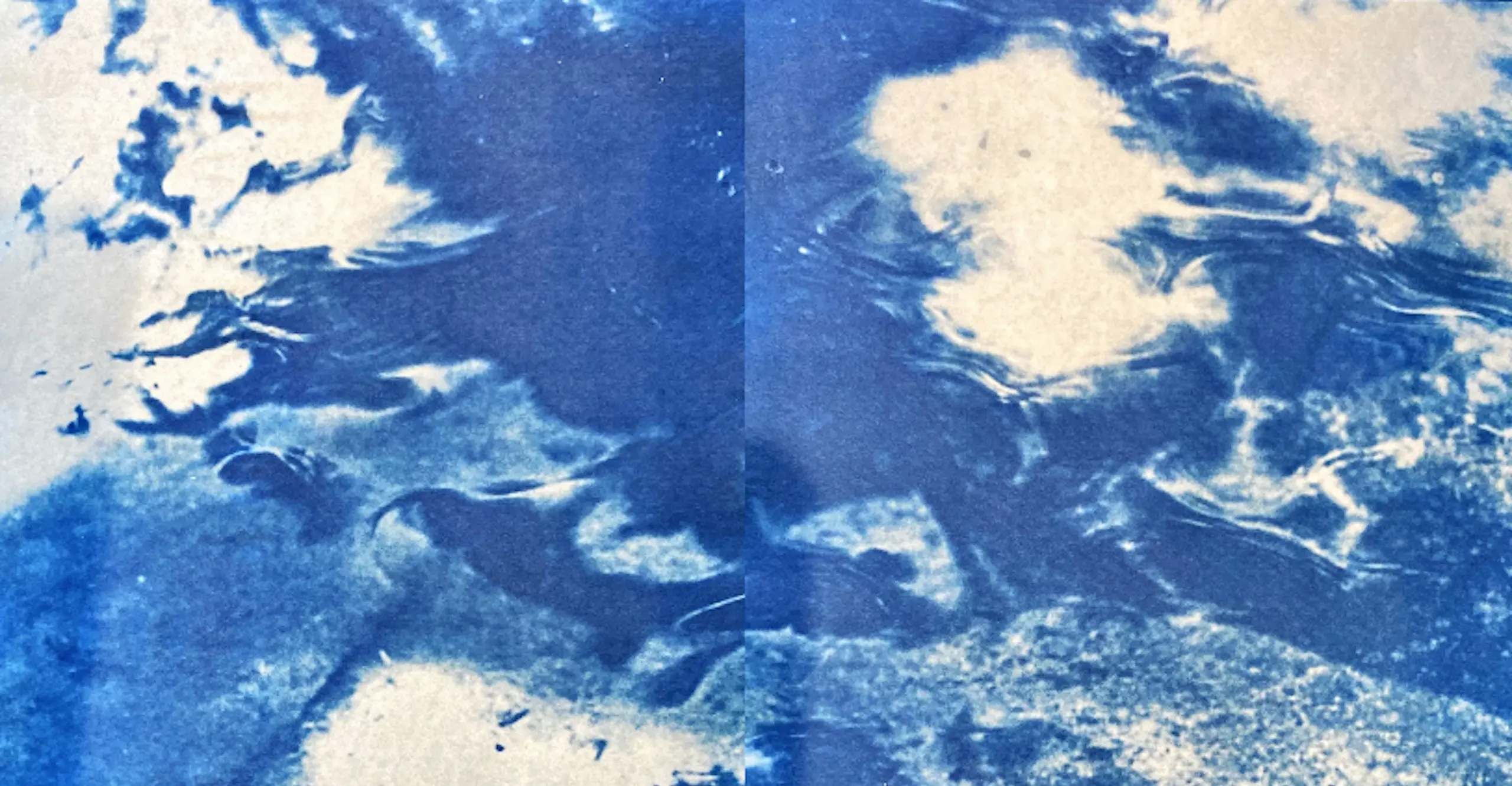 Cyanotype (blue) photograph of a close up surface of water.