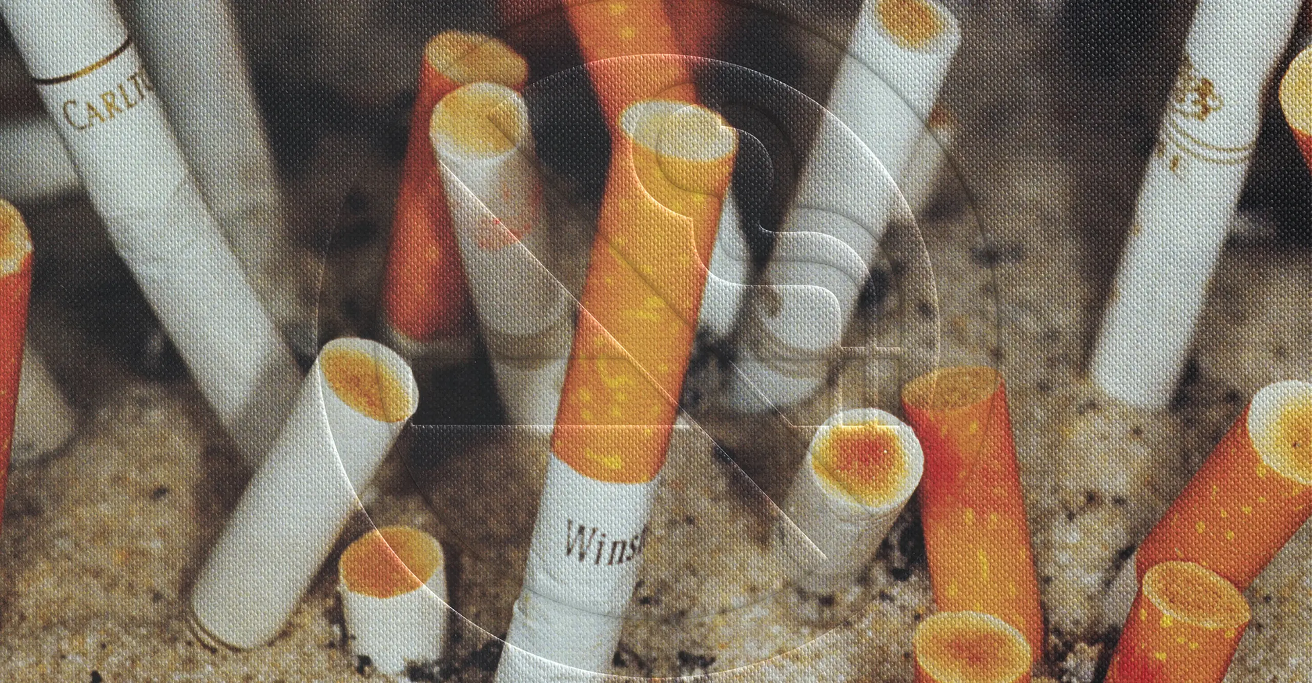 colour photograph of cigarette butts in ashtray