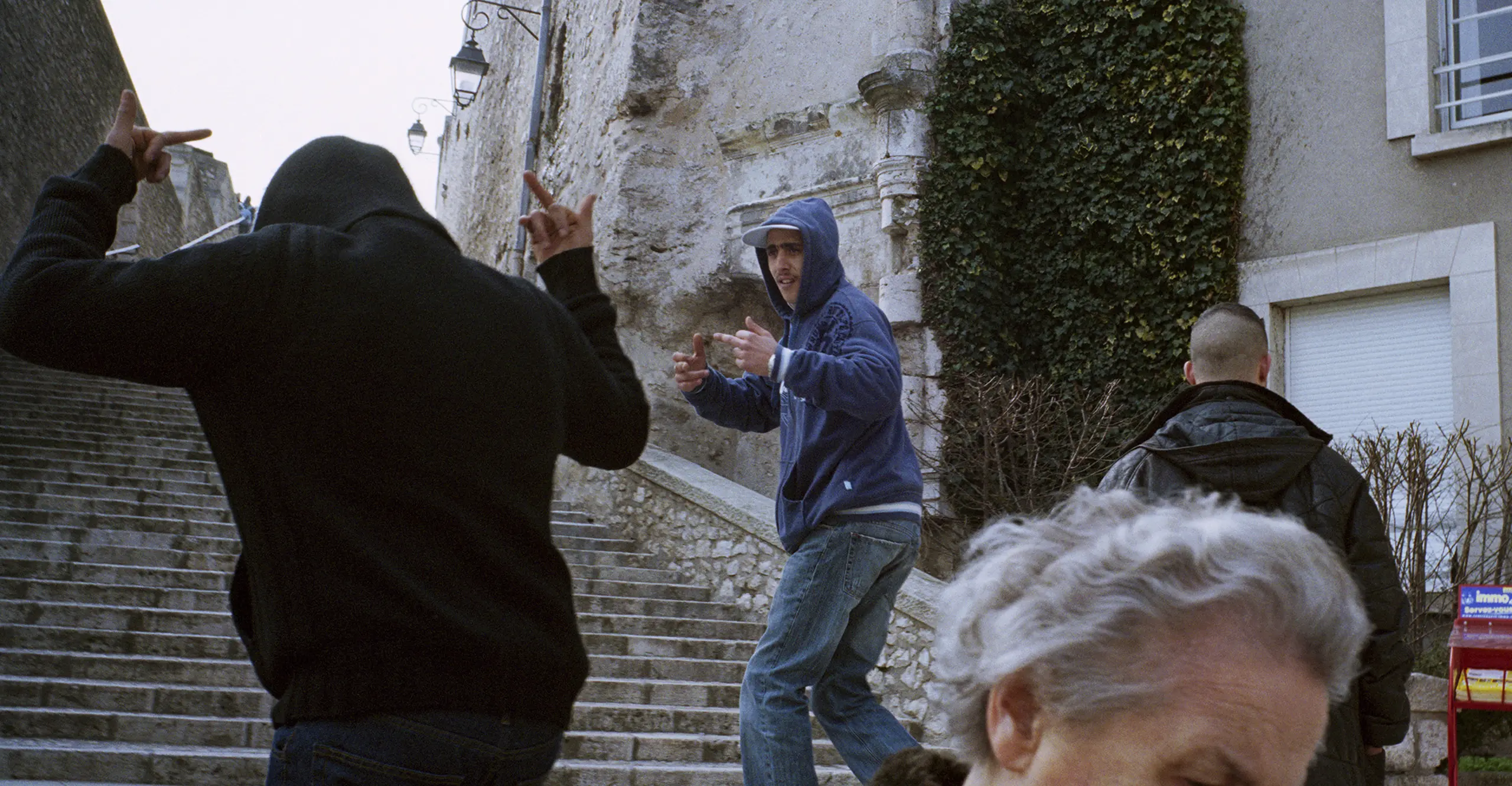 young pople walking up stairs in france town