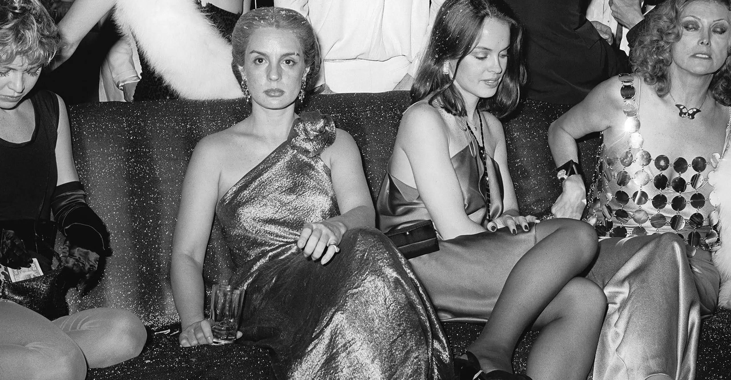 black and white photograph of people partying in the club studio 54