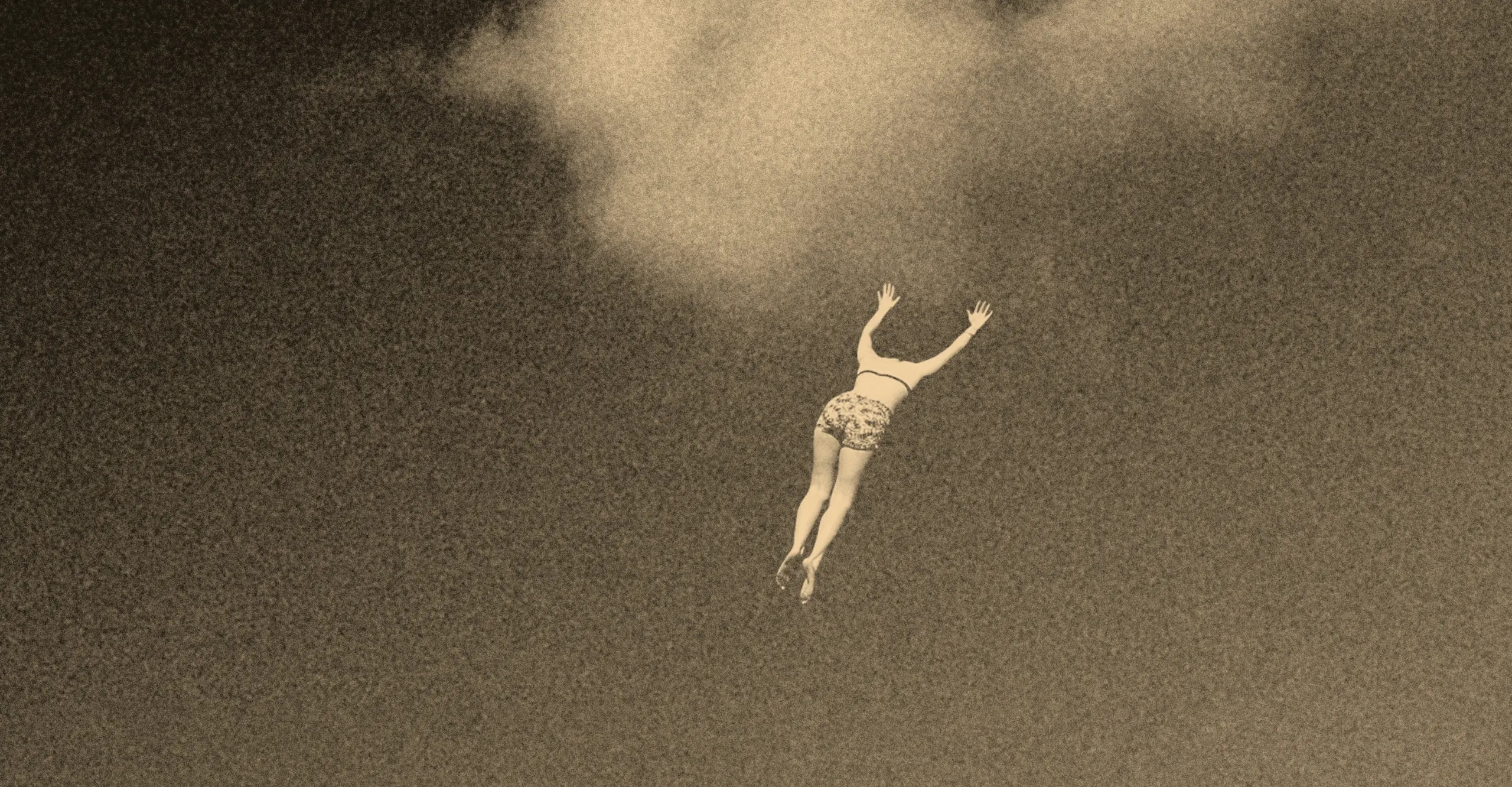 A figure wearing a pair of shorts drifts through the sky towards a lone cloud.