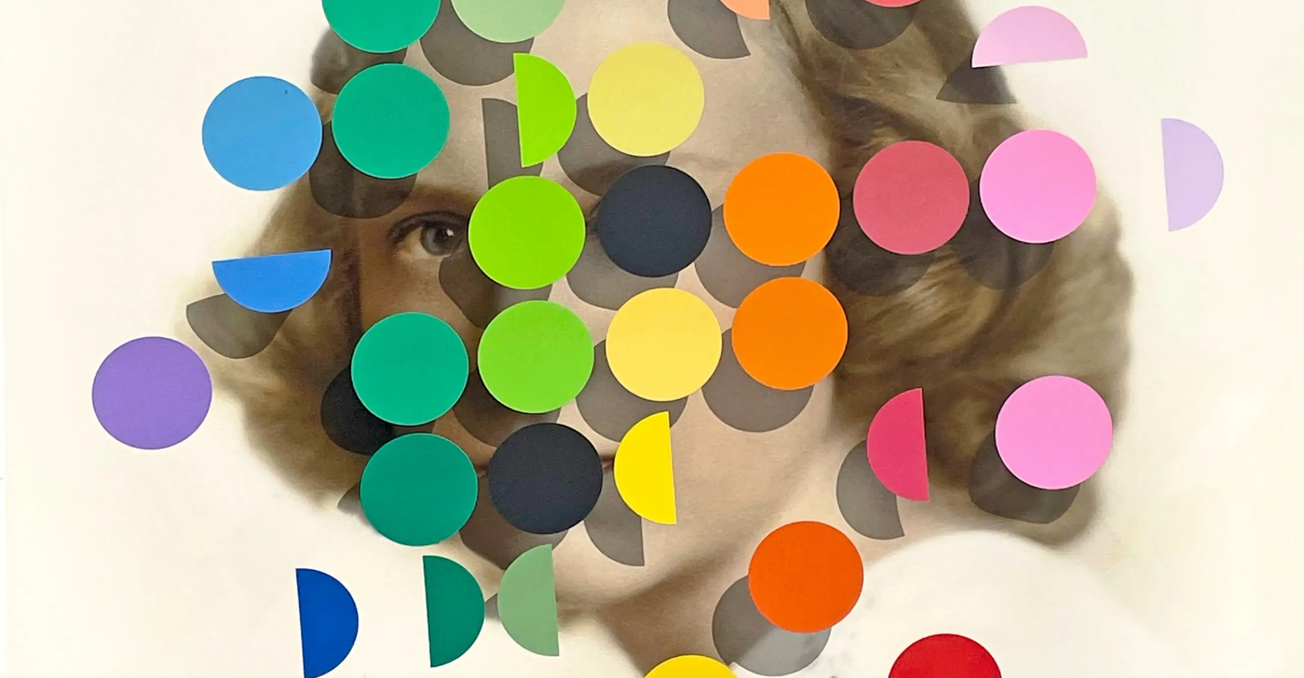 An greyscale portrait of a woman overlayed by multicoloured painted spots.