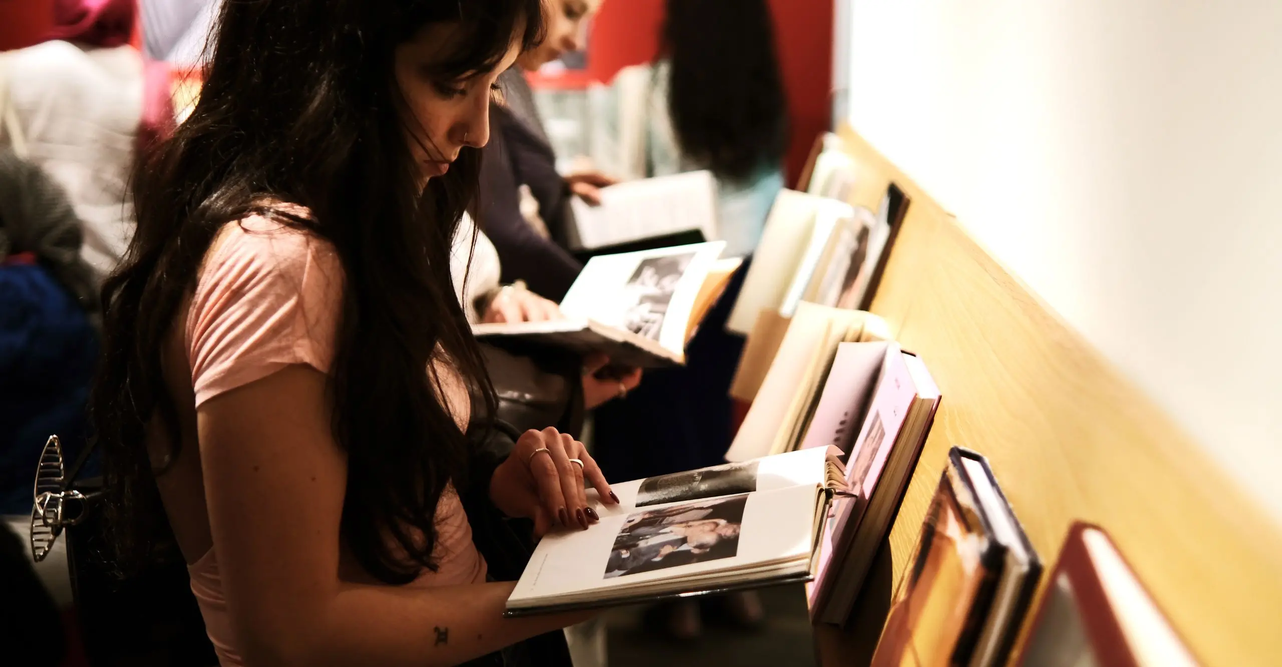 someone looking at a phonebook.