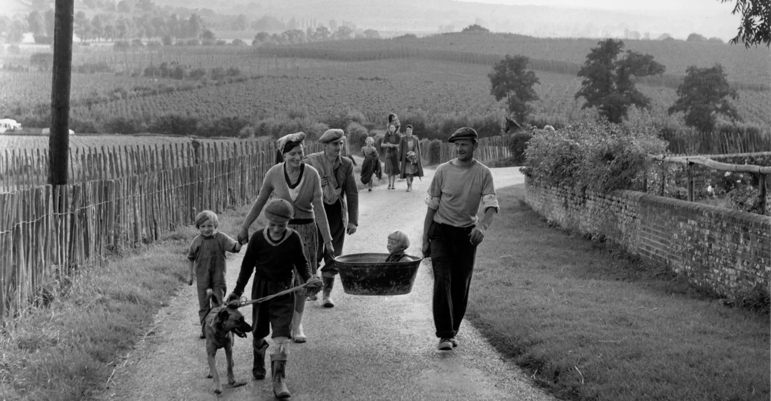 Black and white image of people walking.