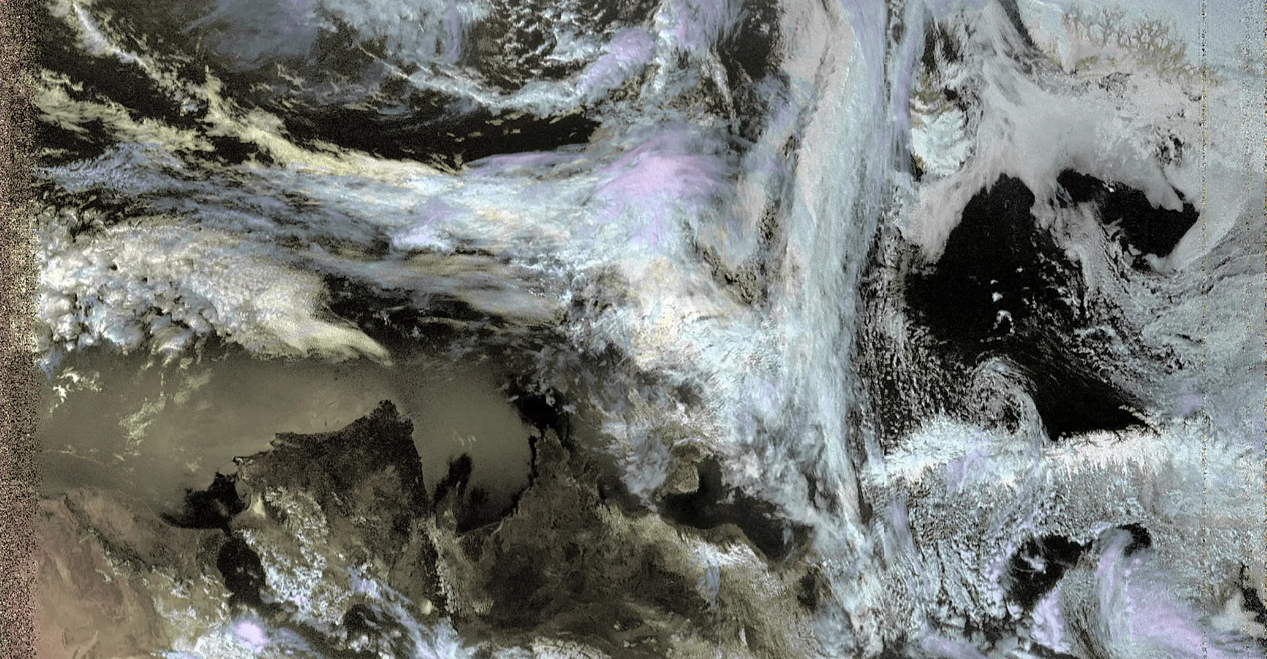 A satellite image of colourful clouds on a gridded background