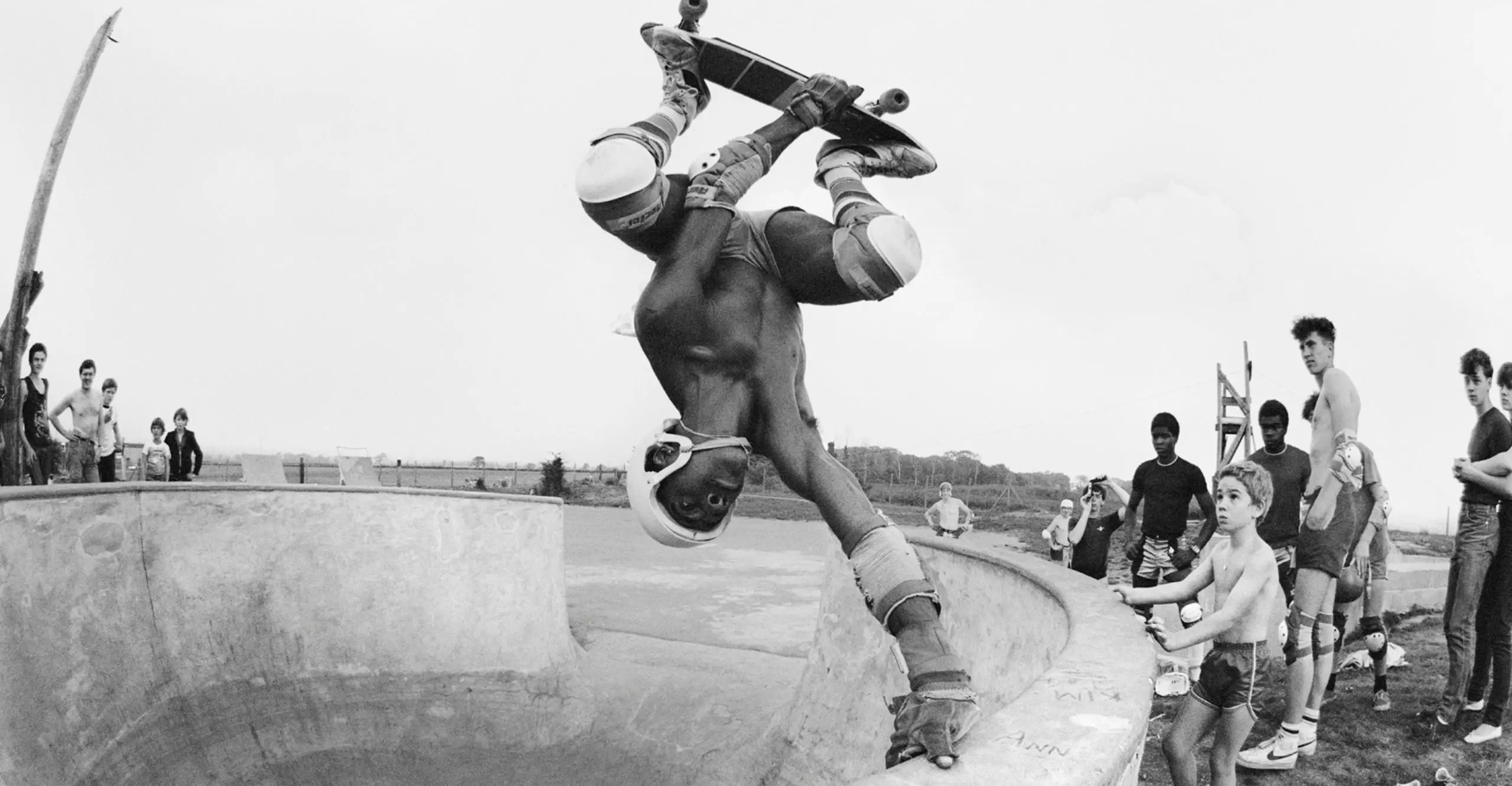 skateboarder upside down in halfpipe