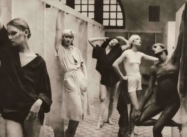 Photograph of five women standing and posing in a bathhouse.