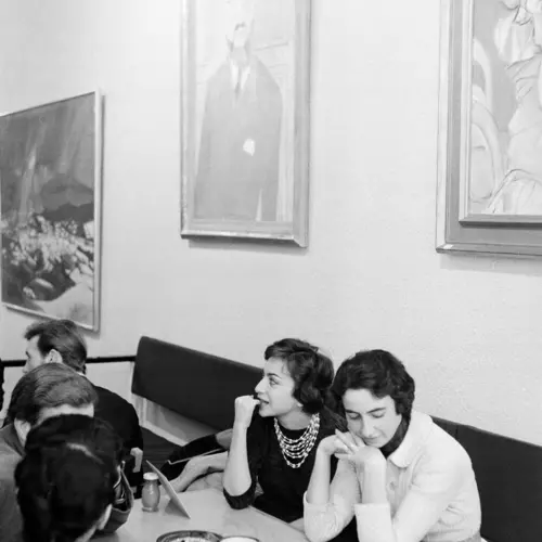 Black and White Photograph, by Roger Mayne, showing two women sitting down, drinking coffee at the Partisan Coffee House, displayed at The Photographers' Gallery in London