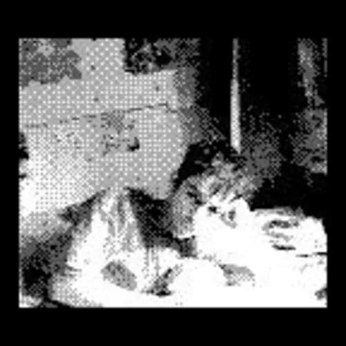 A black and white pixelated portrait of a man lying down on the bed.