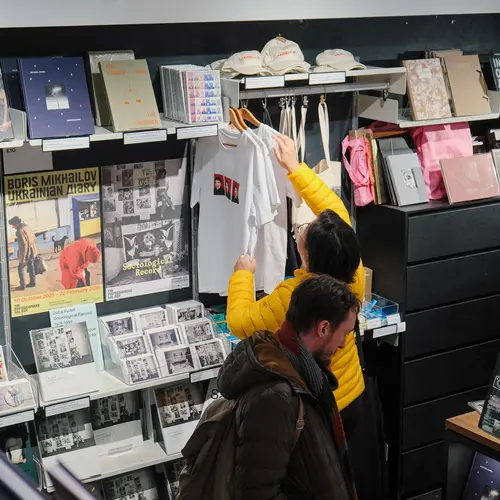People browsing in a bookshop.