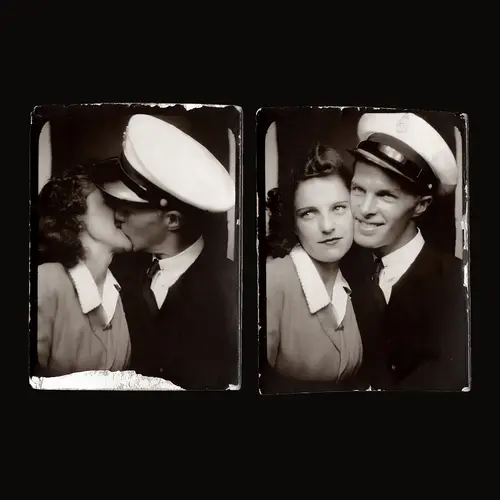 Black and white vintage scanned photographs of a couple posing in a photobooth shot. The man wears a naval hat and the woman weara a frock with a white collar.