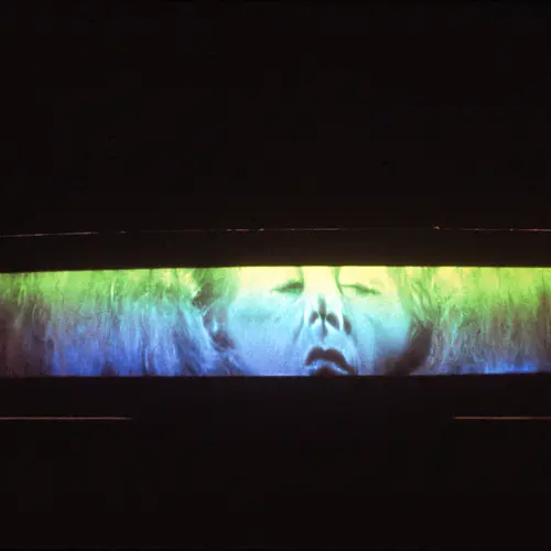 A Woman, 1979. 65" x 12" film mounted on perspex curved mount arc radius 38".  Courtesy Center for Advanced Visual Studies Special Collection, MIT Program in Art, Culture and Technology (ACT).