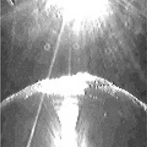 Five black and white pixelated photographs of an alien and a UFO