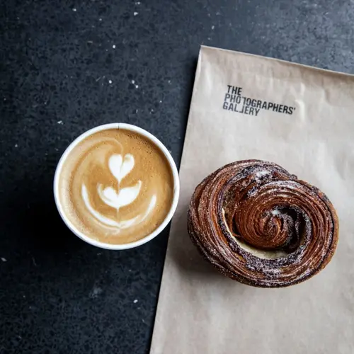 Colour photograph of a coffee and pastry