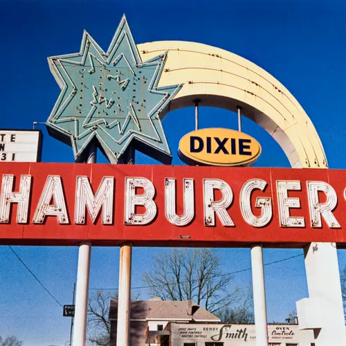 A roadside sign that reads 'HAMBURGERS'