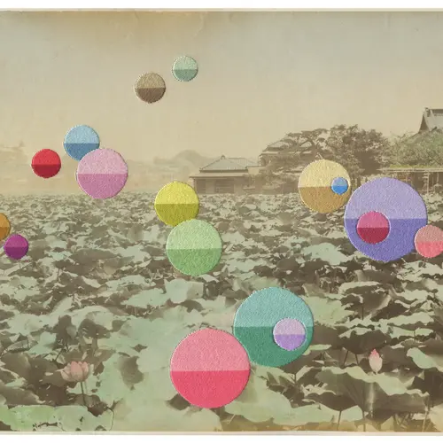 A vintage image of fields with colourful circles sewn on to it