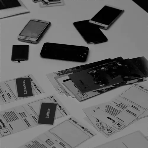 A smartphone on a table, having been dismantled