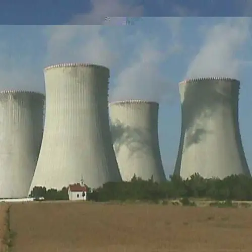 A glitched landscape photograph of a nuclear power plant 