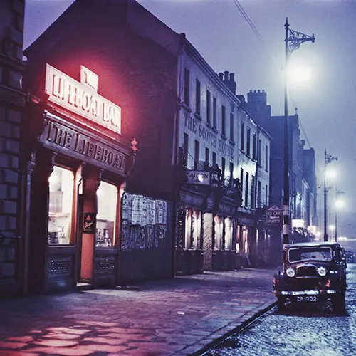 Colour photograph of night time street scene