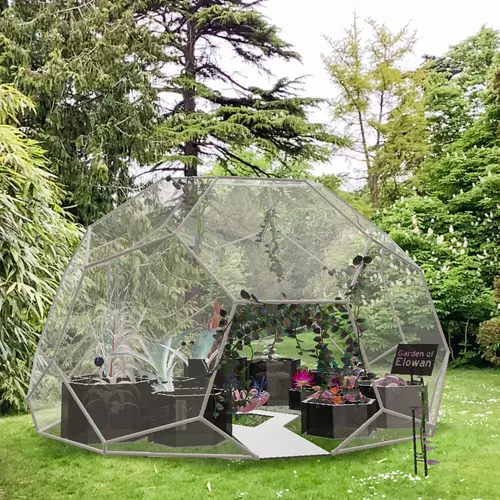 An augmented reality greenhouse appears in a real green space