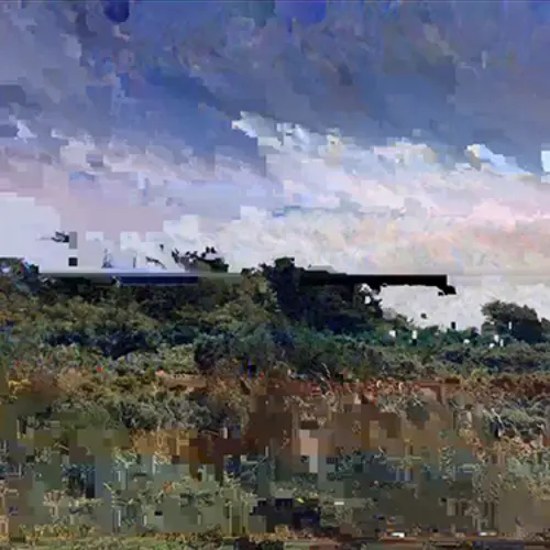 A pixelated and glitched photograph of a landscape