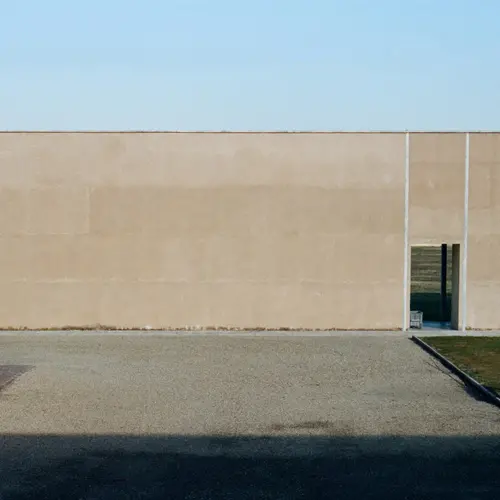 Landscape format exterior colour photograph of a courtyward