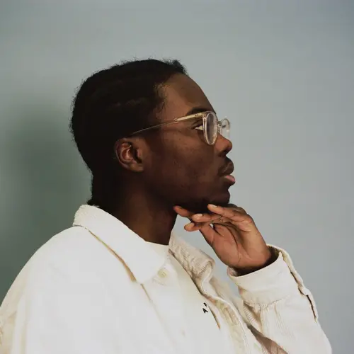 Side portrait of artist. 