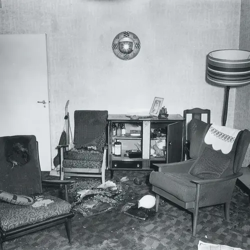 9 January 1974, Balham SW12 View of lounge. Note seats of burning in two of fireside chairs, also on right of picture scorching can be seen on wall just above coffee table. 
