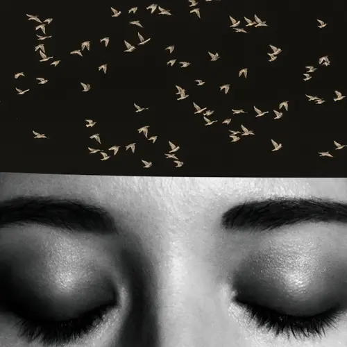 Black and white photograph of a close-up of a person’s eyes, with birds against a black background collaged over their forehead