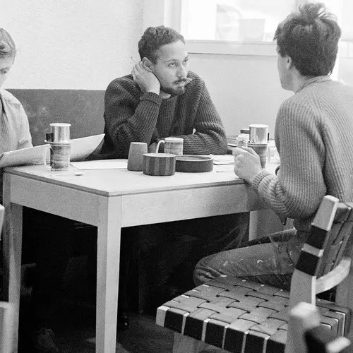 image of women at a table playing chess and discussing at the original partisan coffee house in soho, seen at the photographers gallery