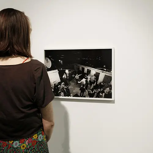 Woman looking at Randa Shaath, Under the Same Sky: Rooftops of Cairo (2002-2003)